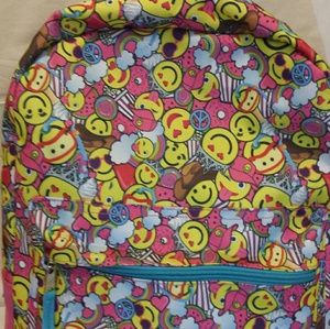 A pink emoji backpack and matching pencil case